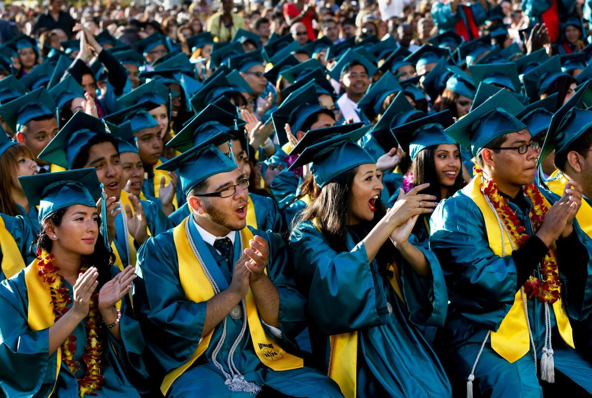 Graduates exult at the Ramon C. Cortines School of Visual & Performing Arts in Los Angeles. The high school graduation rate in California has topped 80% for the first time in state history, officials announced Monday.