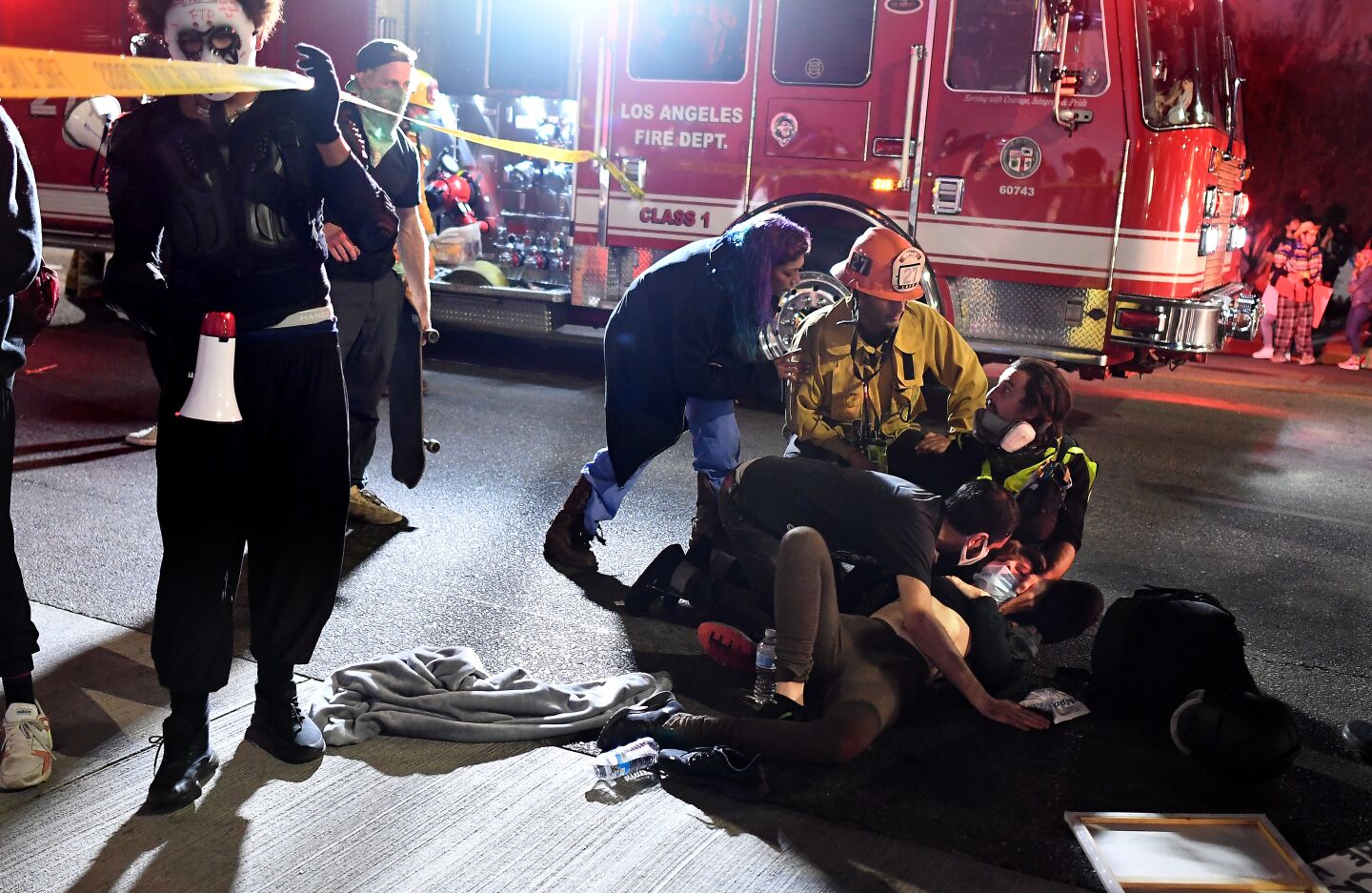 Paramedics help protester who was hit by a truck