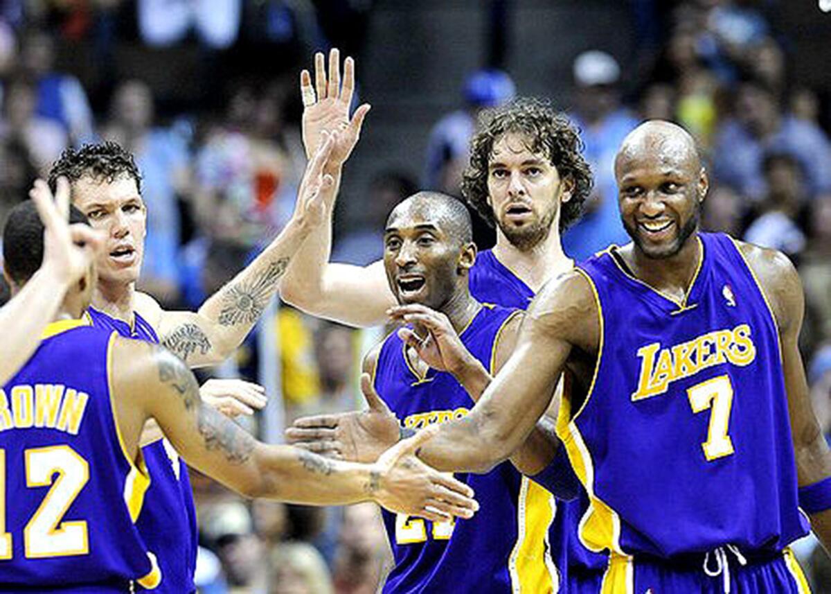 Lakers teammates (from right) Lamar Odom, Pau Gasol, Kobe Bryant and Luke Walton congratulate Shannon Brown after scored.