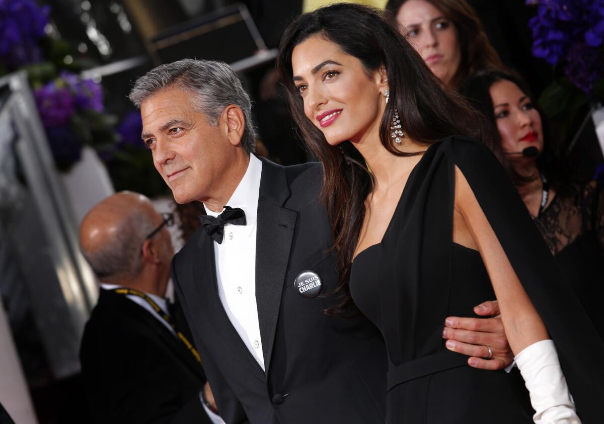 Amal Clooney appears with her husband George at the Golden Globe Awards in January. Her makeup was styled by Charlotte Tilbury.
