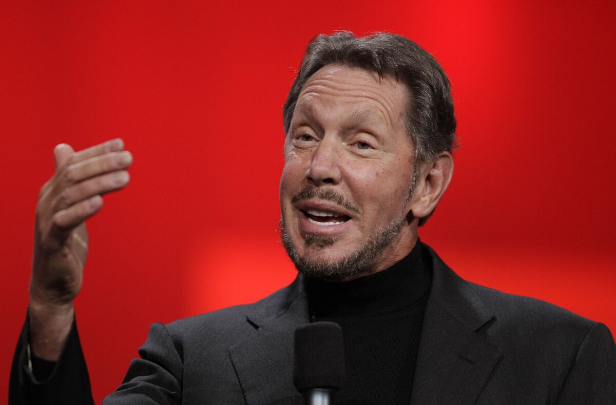 Oracle Chief Executive Larry Ellison gestures while talking.