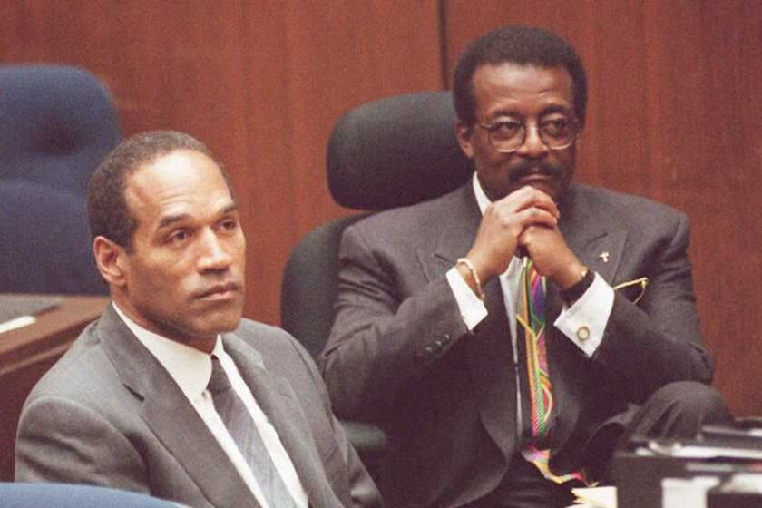 O.J. Simpson and attorney Johnnie Cochran Jr. listen to Judge Lance Ito moments after the prosecution rested its case during Simpson's murder trial on July 6, 1995, in Los Angeles.