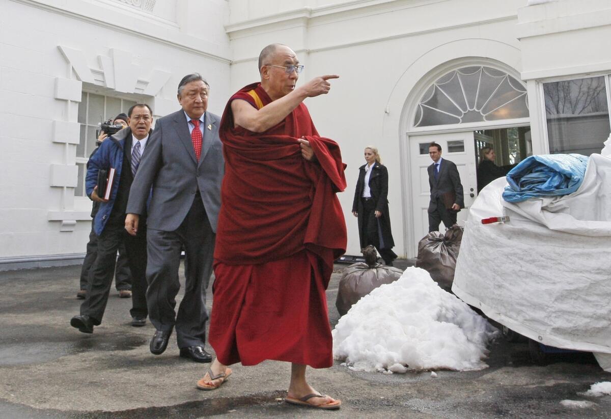 The Dalai Lama leaves the White House after a meeting with President Obama.