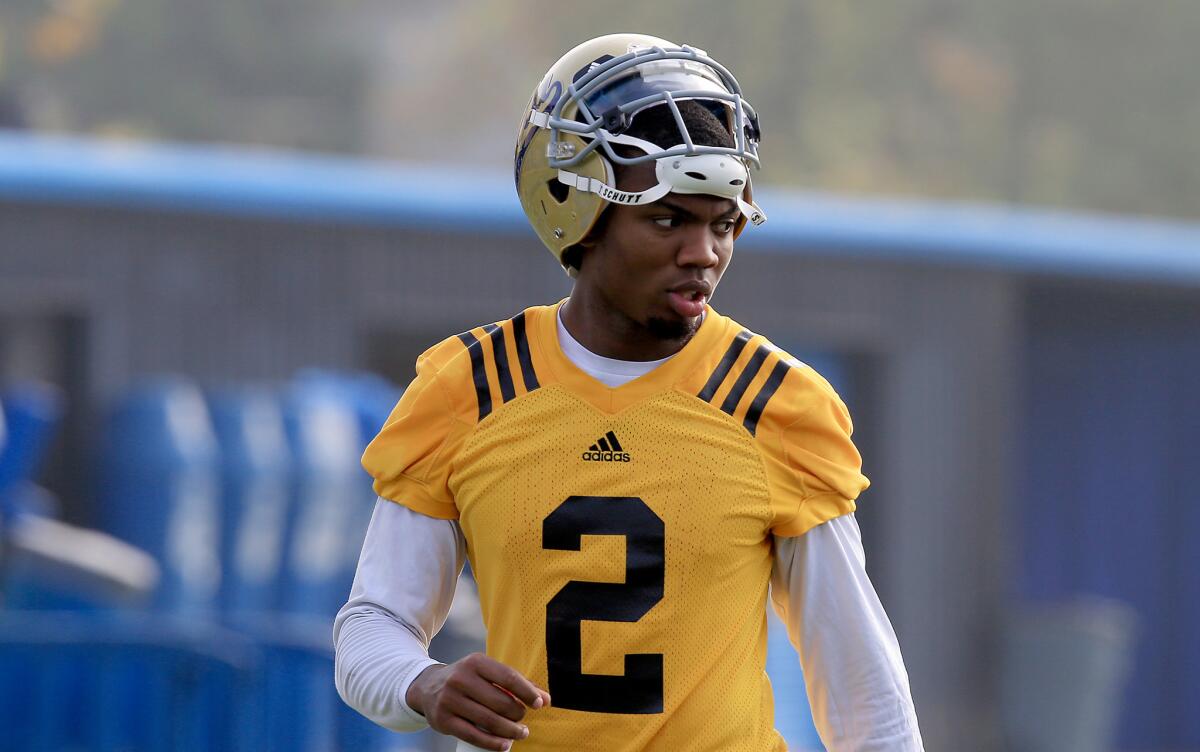 UCLA quarterback Asiantii Woulard takes part in the Bruins' spring practice opener on March 31.