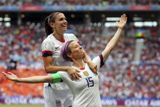 FILE - United States' Megan Rapinoe, right, celebrates after scoring the opening goal.