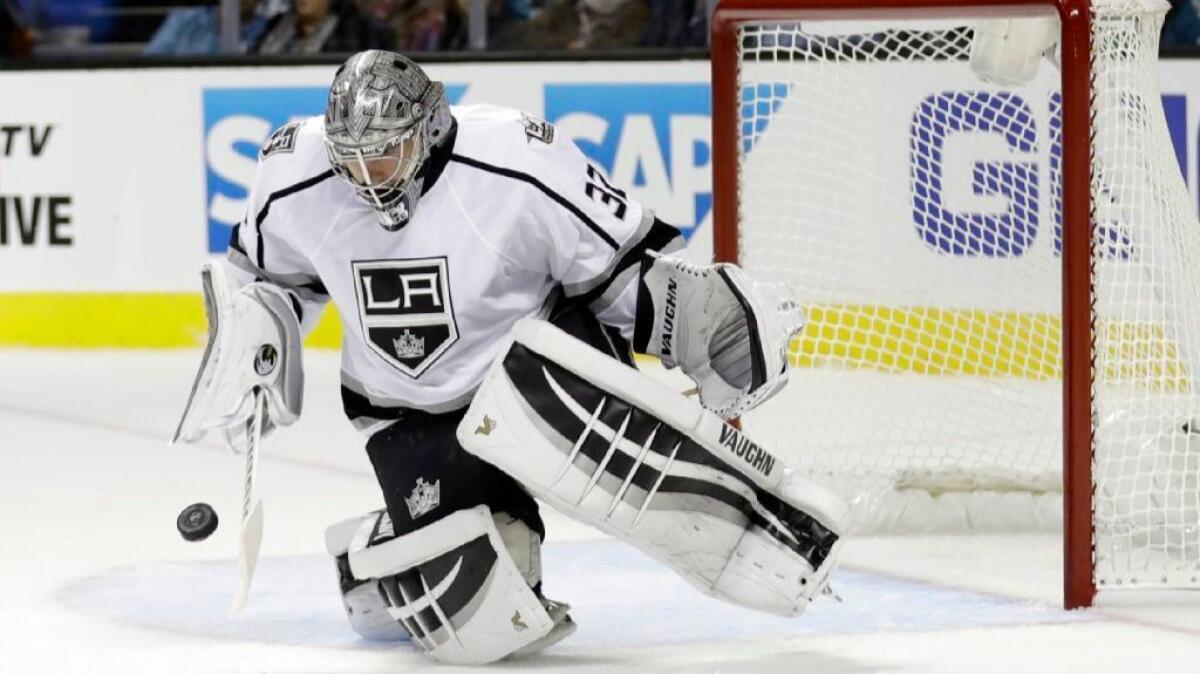 Kings goalie Jonathan Quick stops a shot during a game against the San Jose Sharks on Oct. 12.