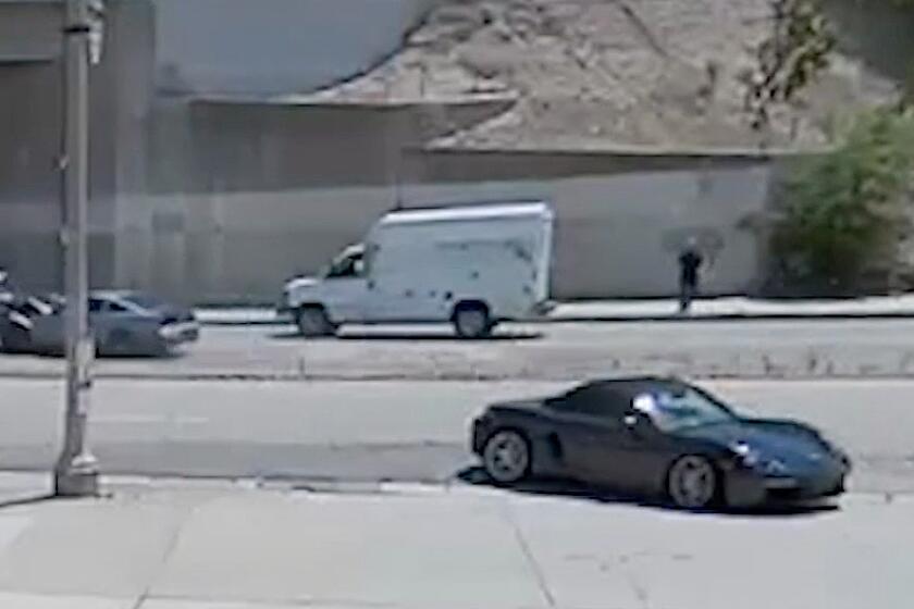 Video still of the incident shows the driver of a blue Mustang crashing into an SUV. The driver then hits a pickup truck as the driver of the SUV gets out of her car. The driver of the Mustang then crashes into another truck and a Porsche, the video shows.