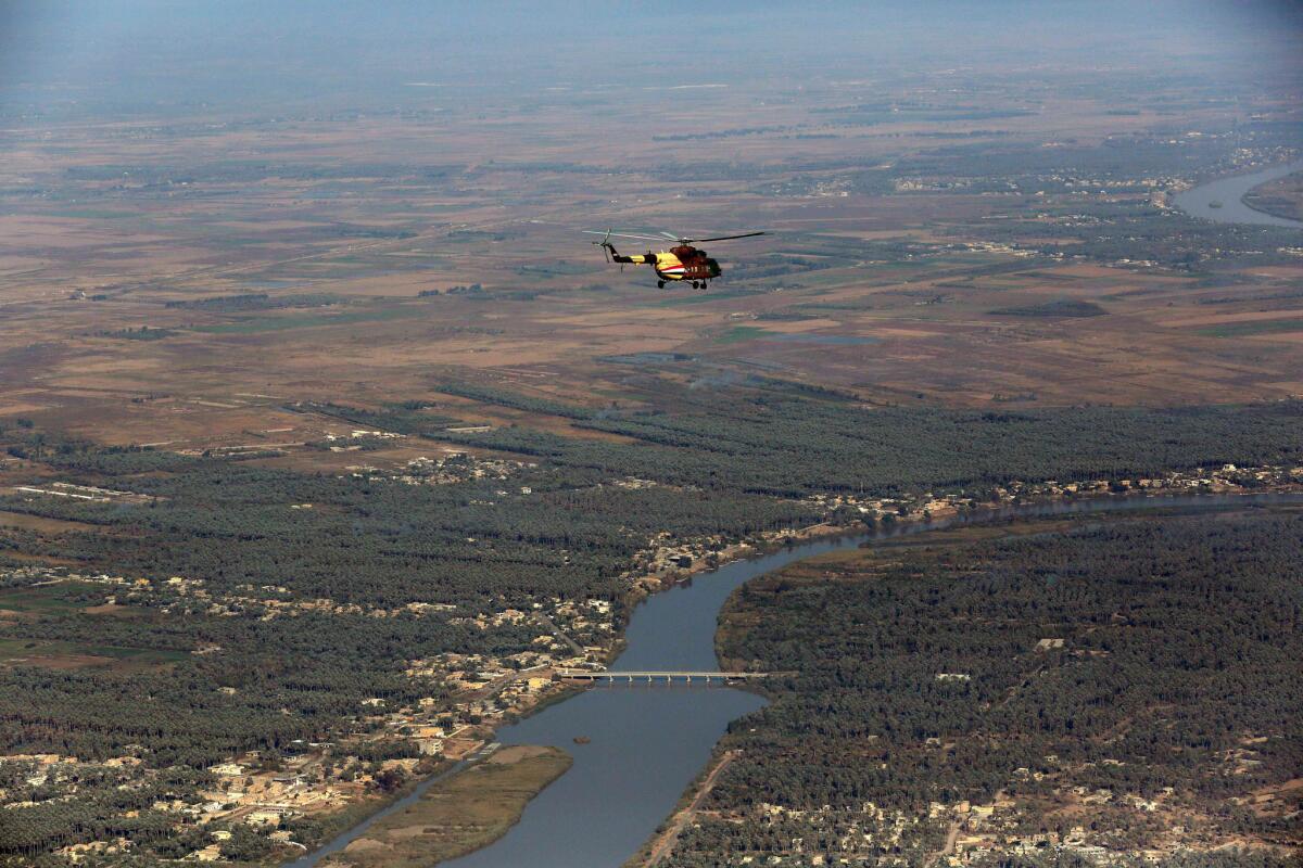 An Iraqi Army helicopter flies over Baquba, the capital of Diyala province.