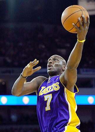 Lamar Odom in action against the Golden State Warriors in Oakland.
