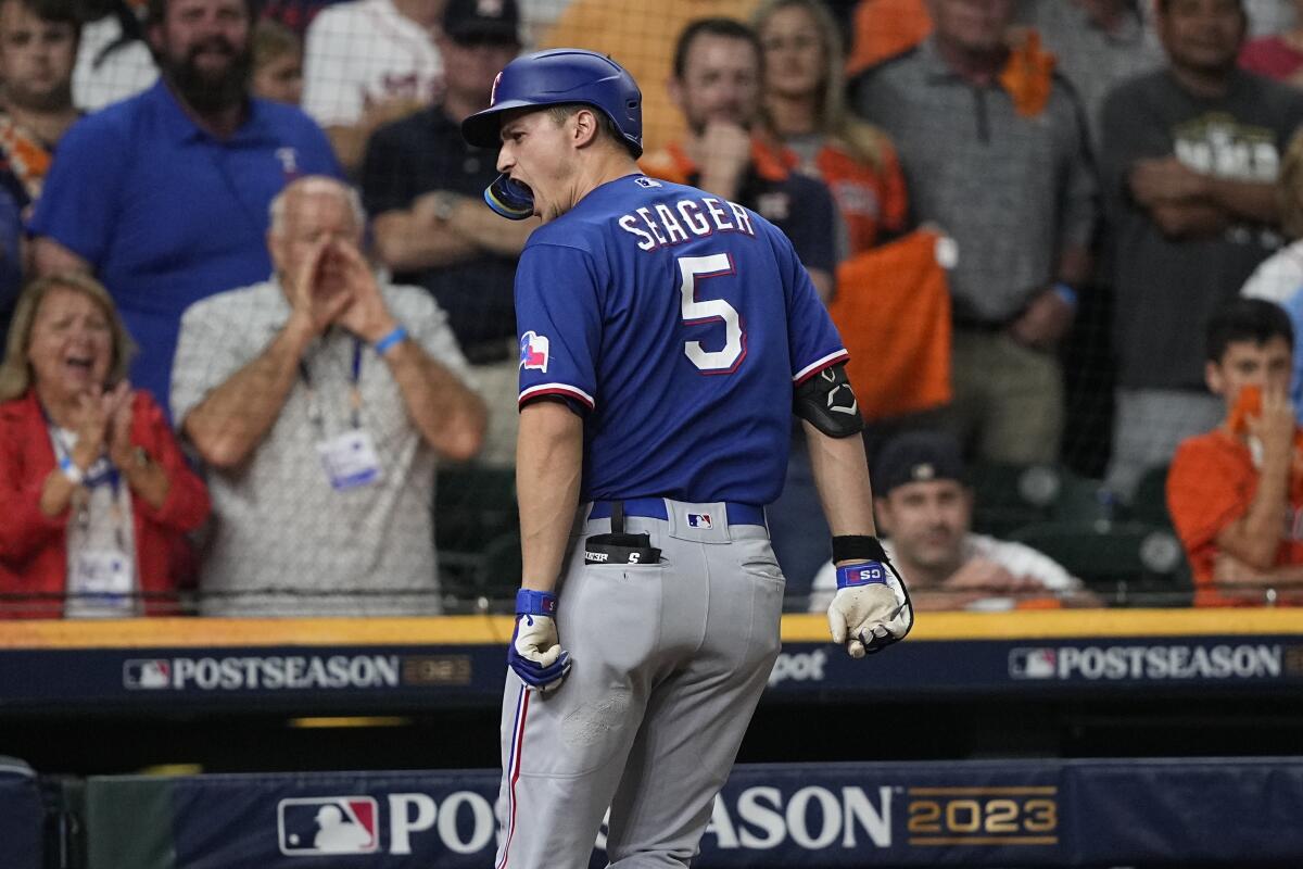 Texas Rangers' Corey Seager reacts after hitting a home run.