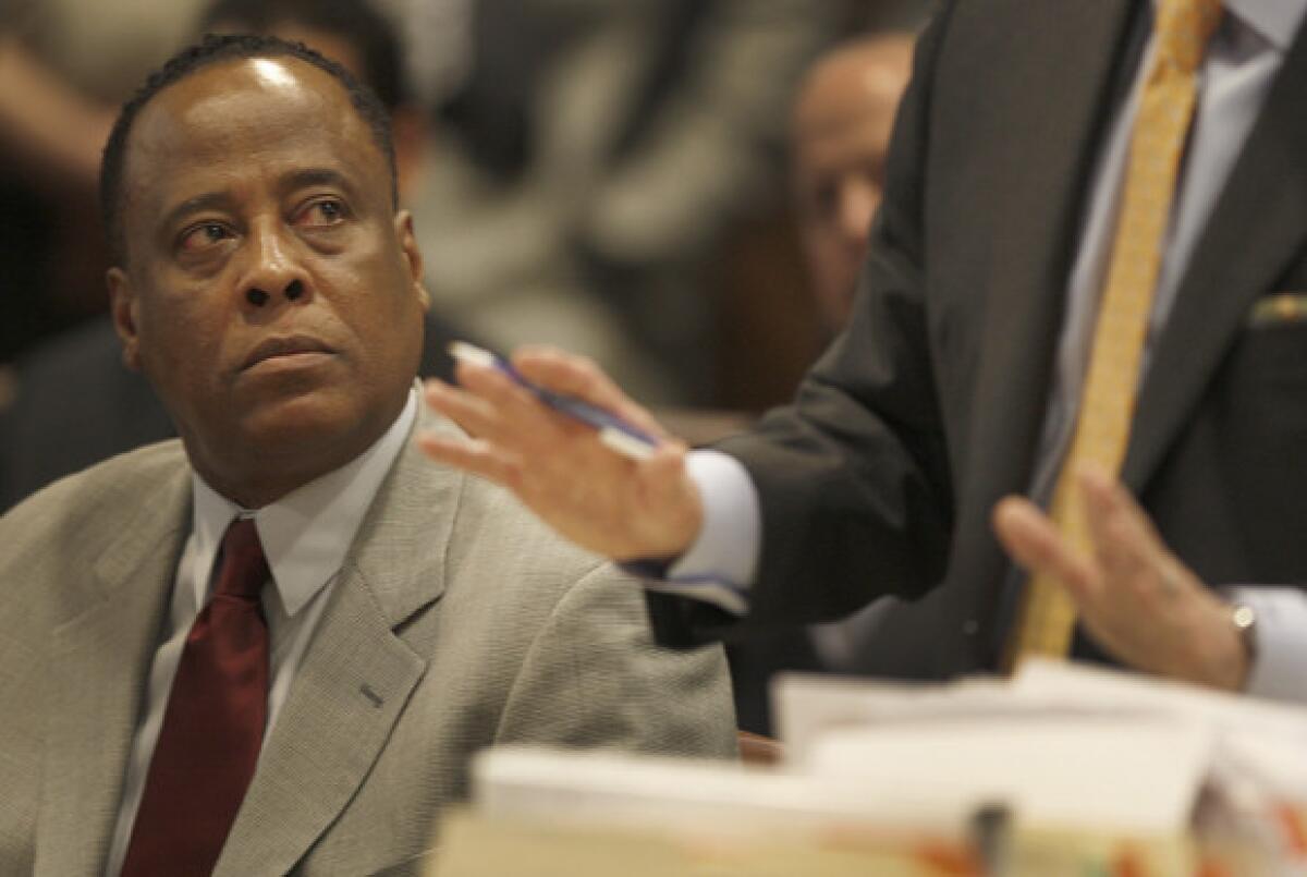 Dr. Conrad Murray listens while his attorney, Ed Chernoff, argues on his behalf during Murray's arraignment on charges of involuntary manslaughter in the death of Michael Jackson.