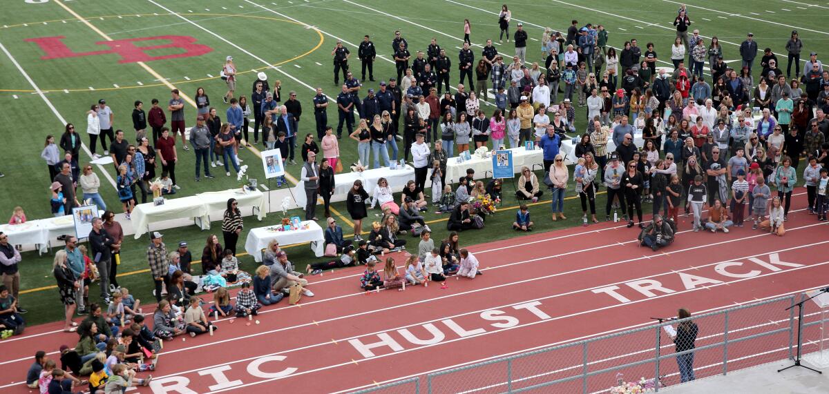 A large crowd turned out at a vigil for El Morro Elementary principal Chris Duddy at Laguna Beach High School on Wednesday.