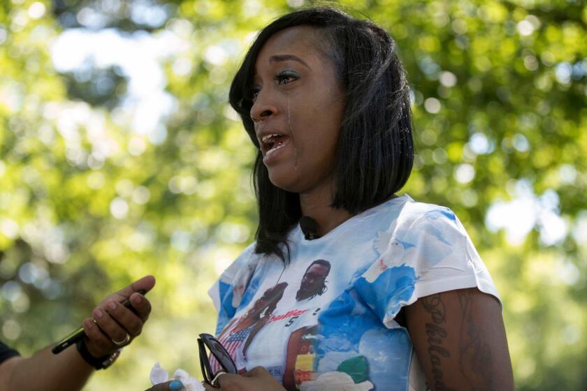 FILE - In this July 6, 2017 file photo, Diamond Reynolds, the girlfriend of Philando Castile, talks in St. Paul, Minn., about what her life has been like since Castile was fatally shot during a traffic stop a year ago. St. Anthony, the Minnesota city that employed the police officer who shot Castile, has reached a financial settlement with Reynolds and her daughter, who were in the car with him when he was killed. The St. Anthony City Council voted Tuesday Nov. 28, 2017 to pay Reynolds and her daughter $675,000. (Jerry Holt /Star Tribune via AP)