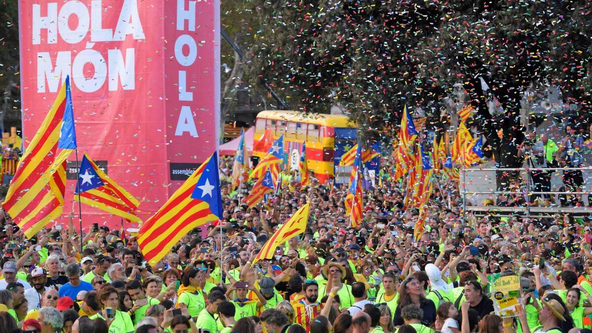 People wave pro-independence Catalan flags at a demonstration on Sept. 11, 2017, in Barcelona, Spain, during the National Day of Catalonia.