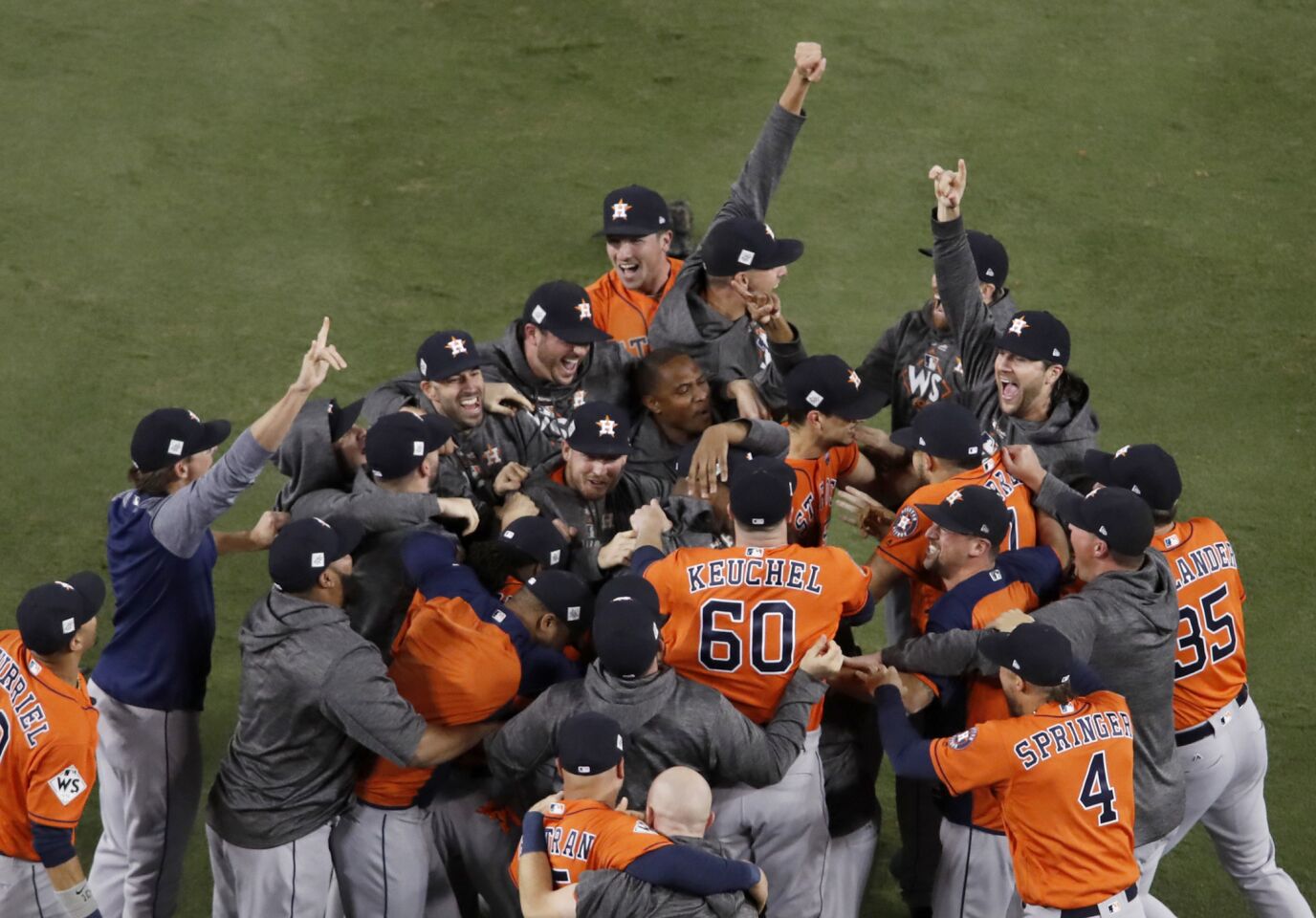 The Houston Astros celebrate beating the Dodgers, 5-1, in Game 7 to win their first World Series.