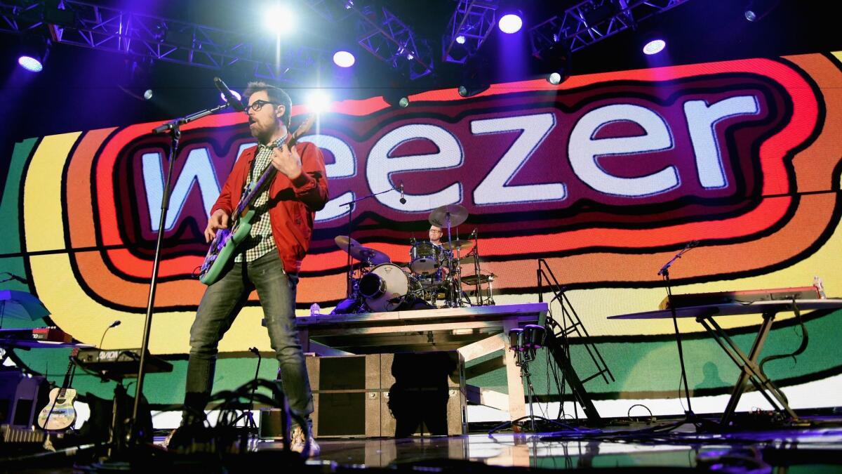 Weezer played songs including "Buddy Holly" and "King of the World" at KROQ's Almost Acoustic Christmas