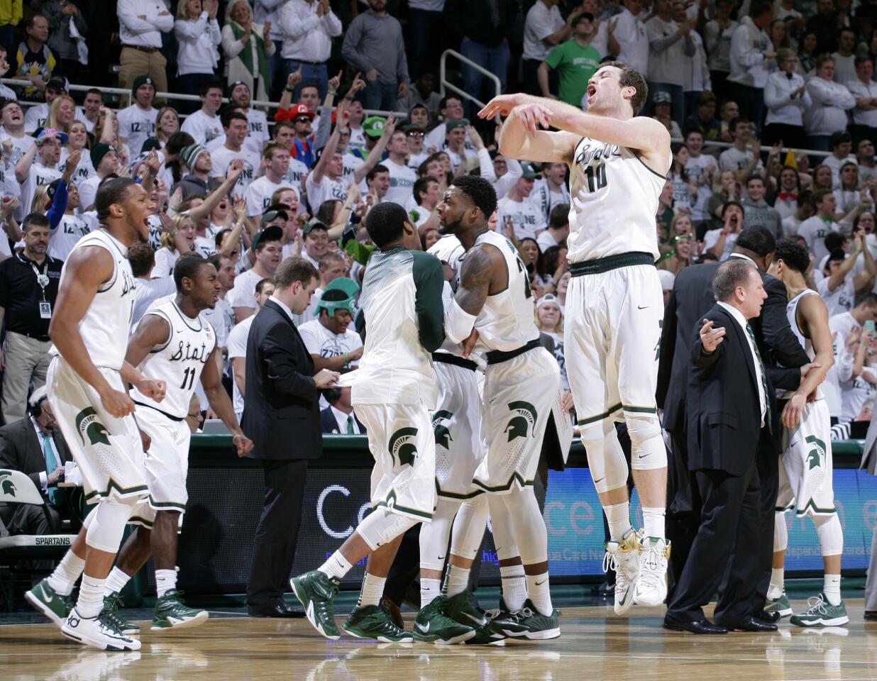 Michigan State players, including Matt Costello (10) celebrate during a game against Michigan at Breslin Student Events Center.