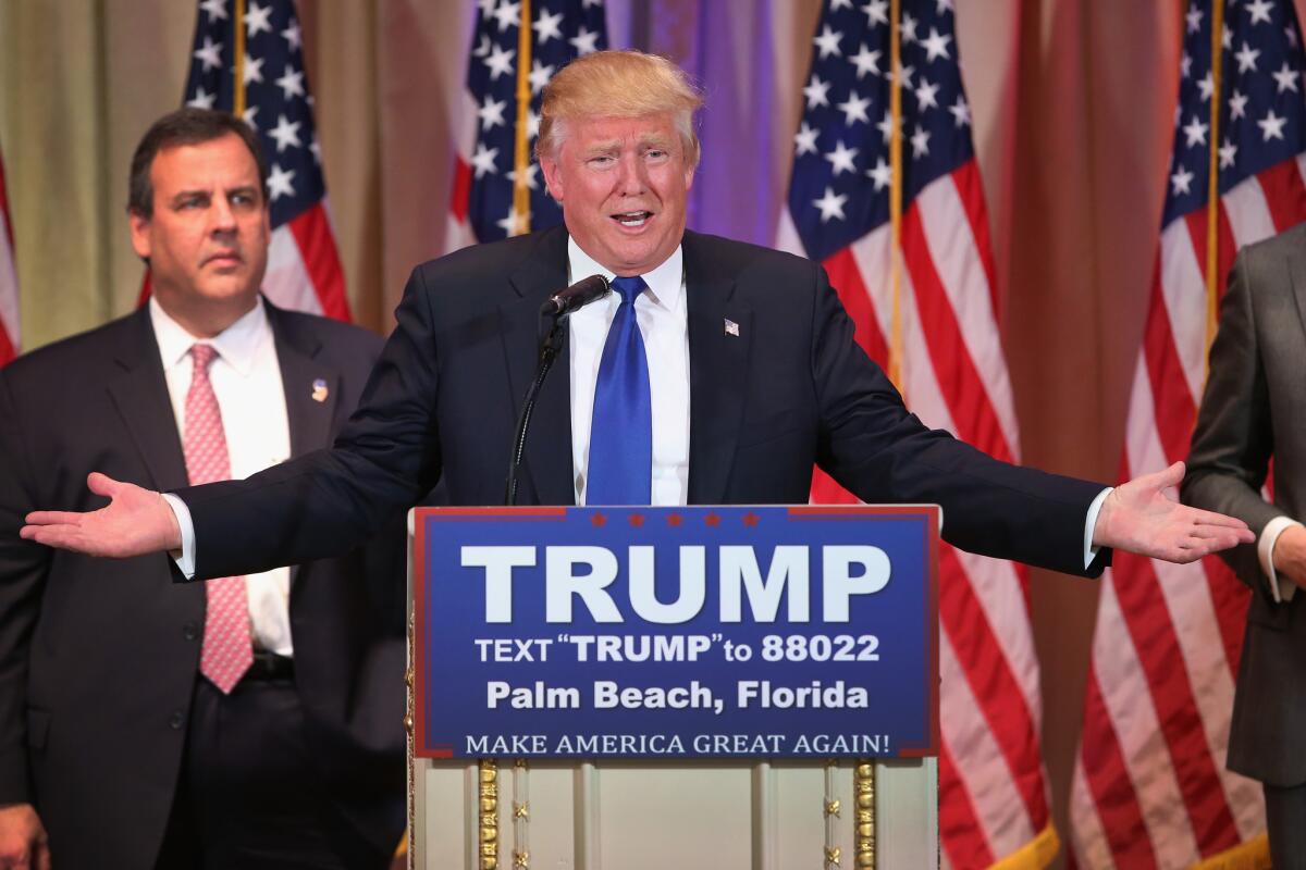 Donald Trump, forgoing the customary election night victory party, addresses reporters at a news conference at his Mar-a-Lago Club in Palm Beach, Fla. With him is New Jersey Gov. Chris Christie.