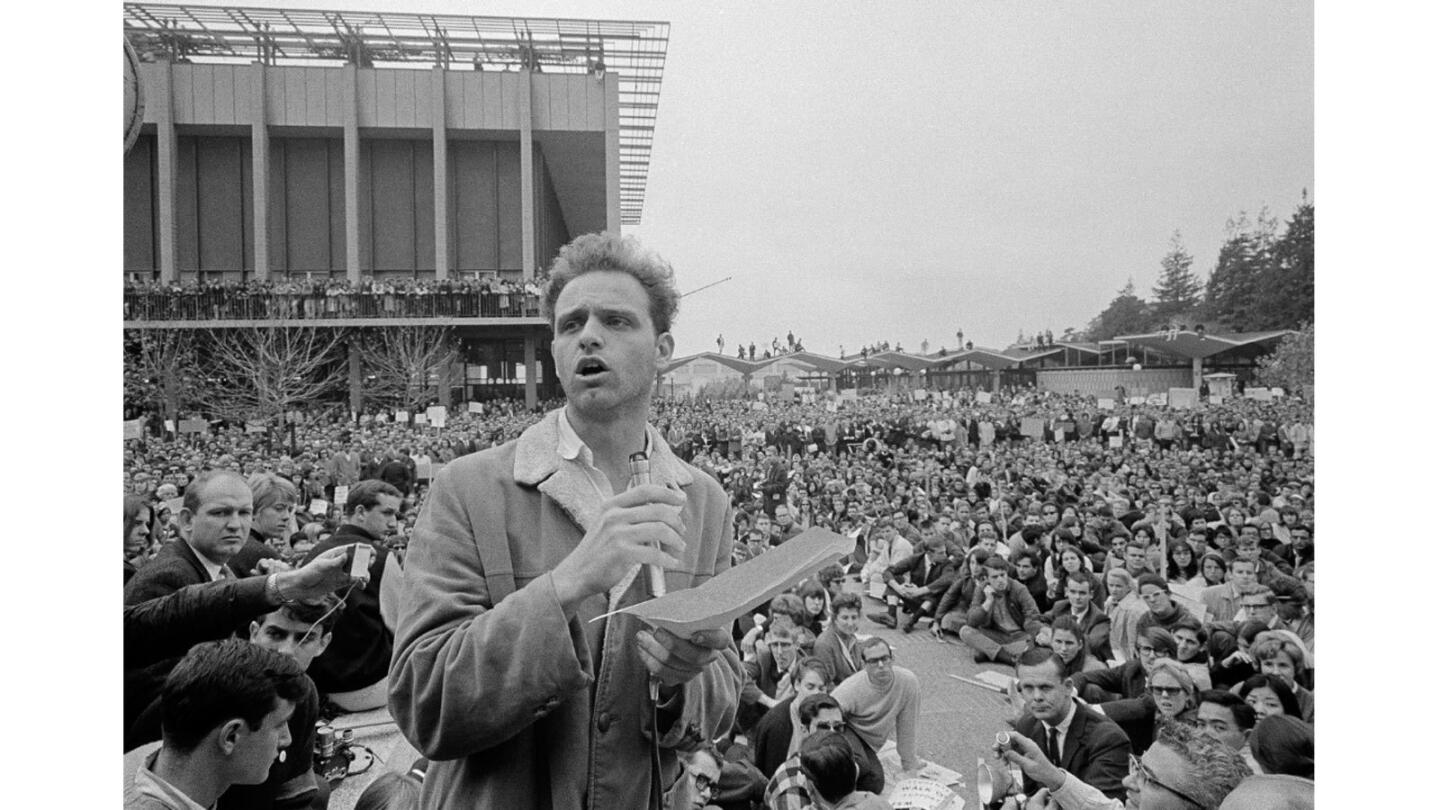 Free Speech Movement leader Mario Savio addresses a crowd of students and media at UC Berkeley in December 1964.