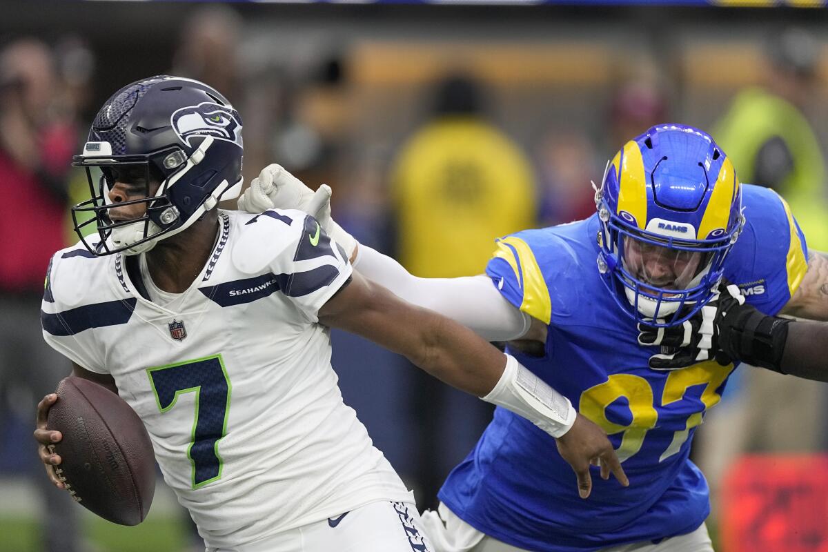 Rams defensive tackle Michael Hoecht sacks Seattle Seahawks quarterback Geno Smith.