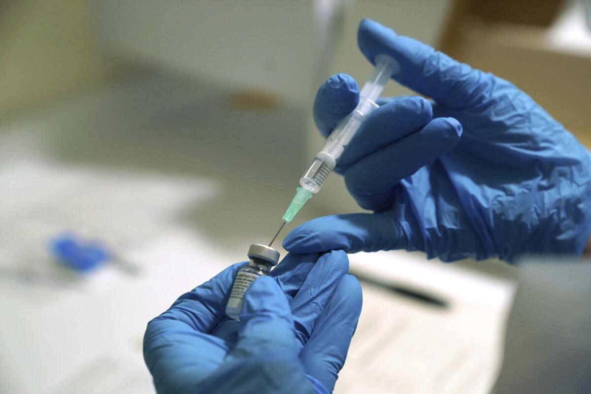 A dose of COVID-19 vaccine is prepared at the Royal Victoria Infirmary in Newcastle, England.