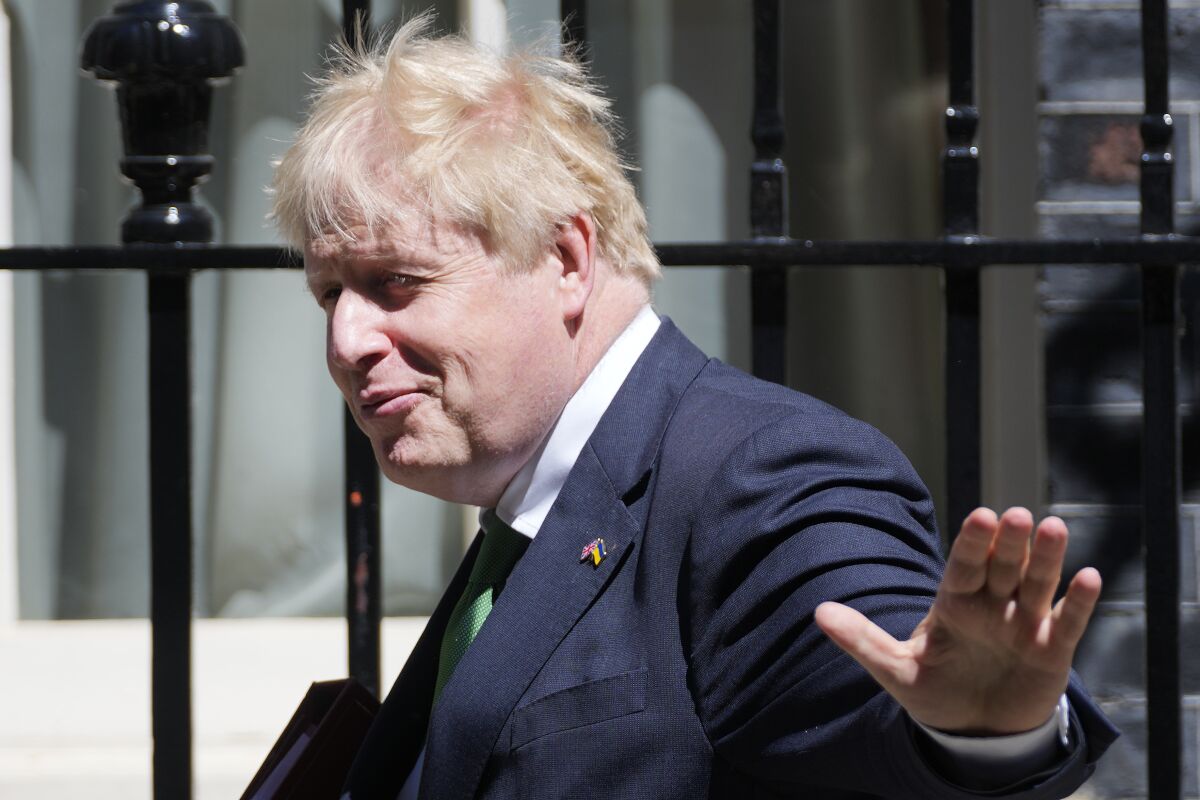 Britain's Prime Minister Boris Johnson leaves 10 Downing Street to attend the weekly Prime Ministers' Questions session in parliament in London, Wednesday, June 8, 2022. (AP Photo/Frank Augstein)