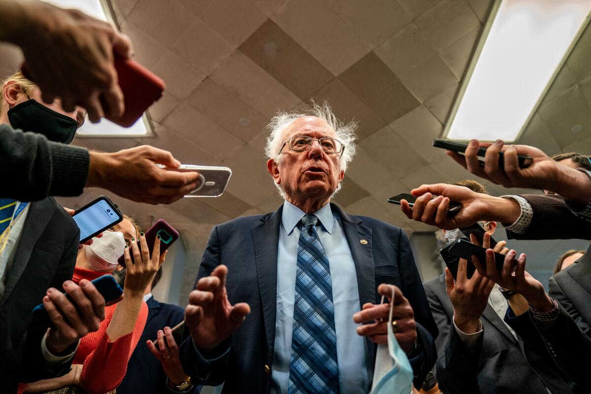 Sen. Bernie Sanders speaks with reporters in the Senate Subway.