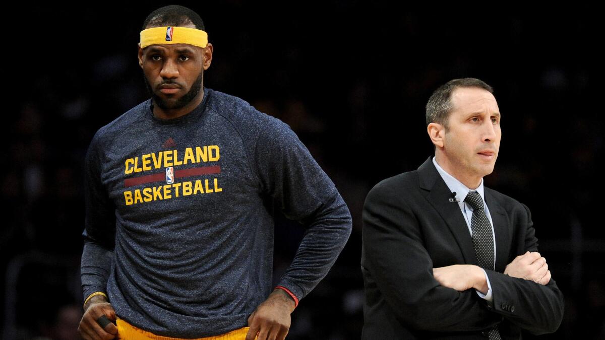 Cleveland Cavaliers star LeBron James, left, returns to the court in front of Coach David Blatt during a win over the Lakers at Staples Center on Thursday.
