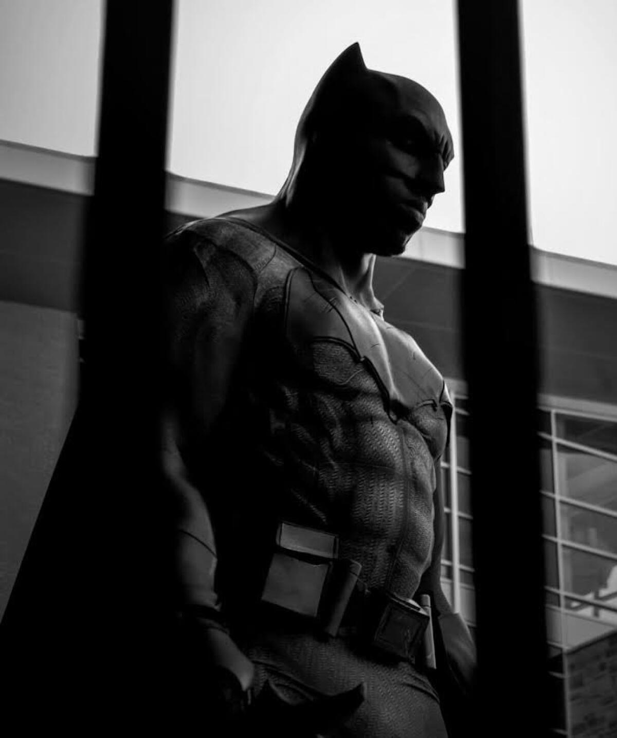 Charles Conley poses as his favorite superhero, Batman.