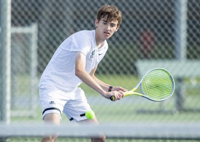 Costa Mesa's Eli Weiss-Hung returns a backhand during a Battle for the Bell match at Costa Mesa High School on Tuesday.