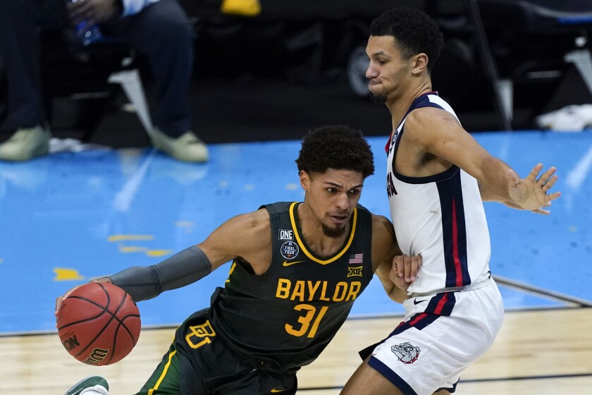 Baylor guard MaCio Teague drives around Gonzaga guard Jalen Suggs during the NCAA championship game.