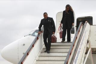 Malawi Vice President Saulos Chilima,left, and his wife Mary disembark from a plane upon his return from South Korea in Lillongwe, Sunday, June 9, 2024. A military plane carrying Malawi's vice president and nine others went missing Monday and a search was underway, the president's office said. The plane carrying 51-year-old Vice President Saulos Chilima left the capital, Lilongwe, but failed to make its scheduled landing at Mzuzu International Airport about 370 kilometers (230 miles) to the north around 45 minutes later. (AP Photo)