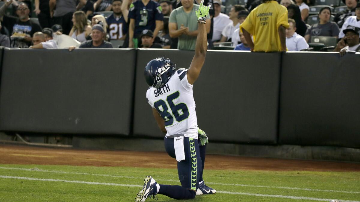 Seahawks wide receiver Rodney Smith (86) celebrates after scoring a touchdown against the Raiders during an exhibition game.