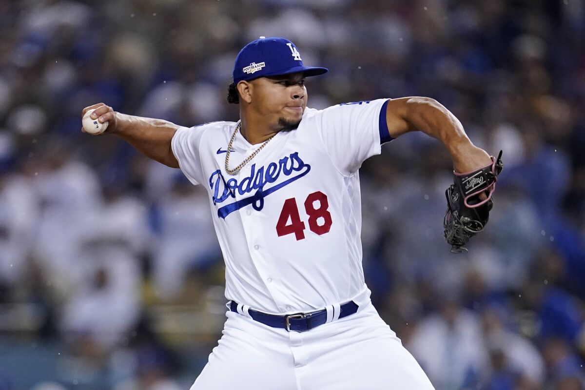 Dodgers relief pitcher Brusdar Graterol delivers a pitch during a game.
