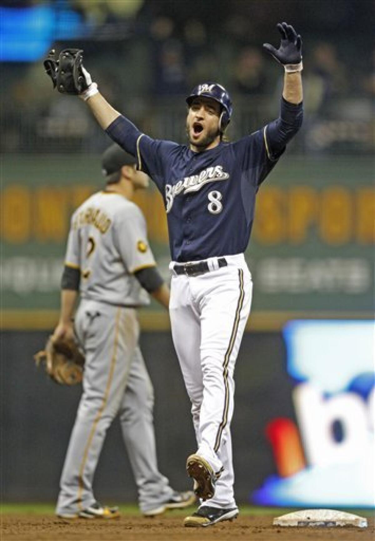 Milwaukee Brewers designated hitter Andrew McCutchen reacts as he
