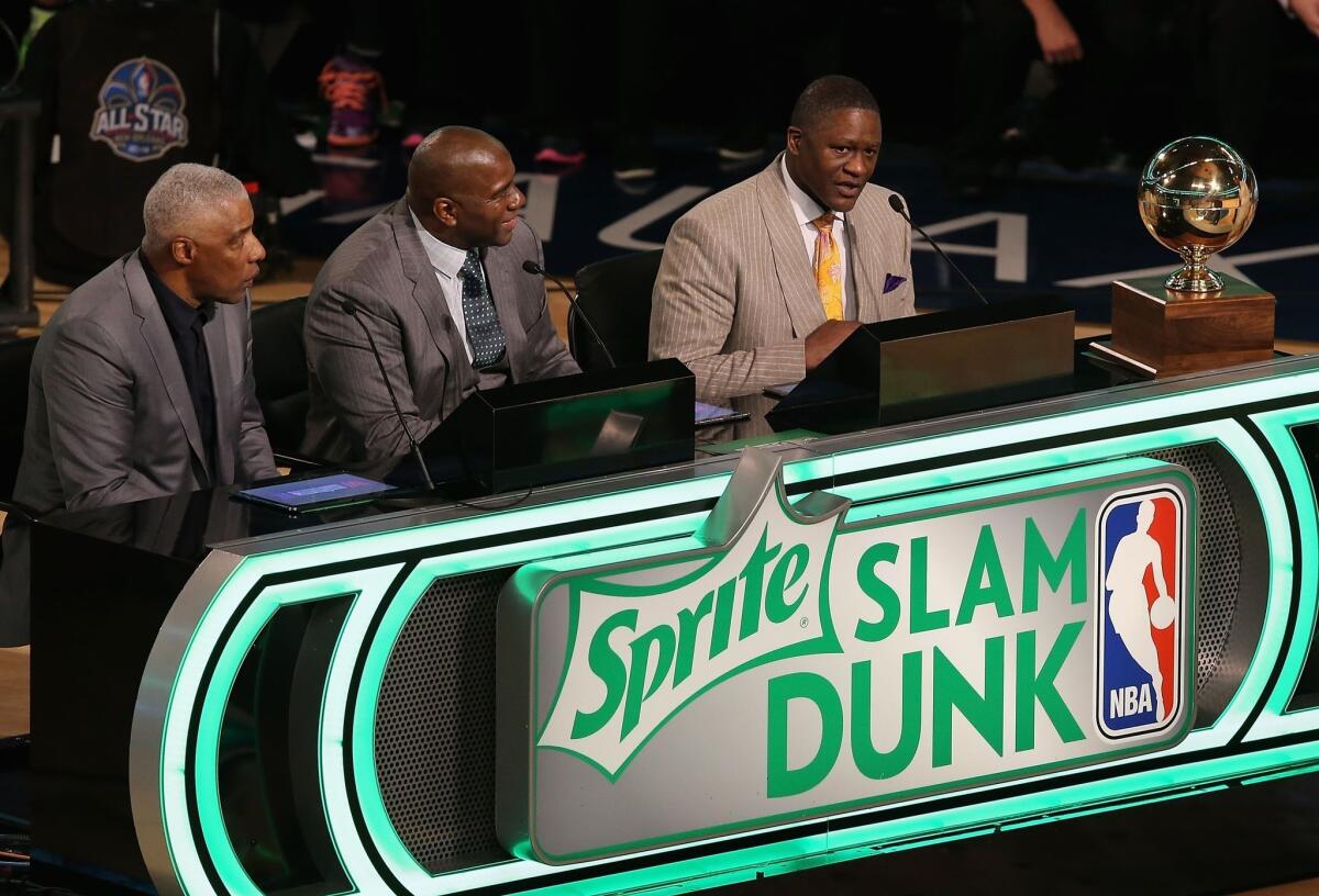 Sprite Slam Dunk Contest 2014 judges (L-R) Julius Erving, Magic Johnson and Dominique Wilkins take part of the 2014 NBA All-Star Weekend at the Smoothie King Center on February 15, 2014 in New Orleans, Louisiana.