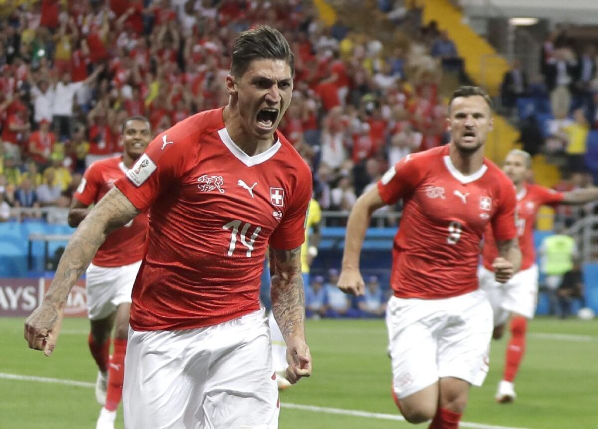 Steven Zuber of Switzerland celebrates after scoring a game-tying goal against Brazil during a group-stage match at the 2018 World Cup.