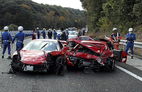 Police officers inspect damaged Ferrari sports cars on the Chugoku highway in western Japan after a 14-vehicle pile-up. Eight Ferraris, two Mercedes-Benzes and a Lamborghini were involved; 10 people were taken to hospitals but none were seriously injured.