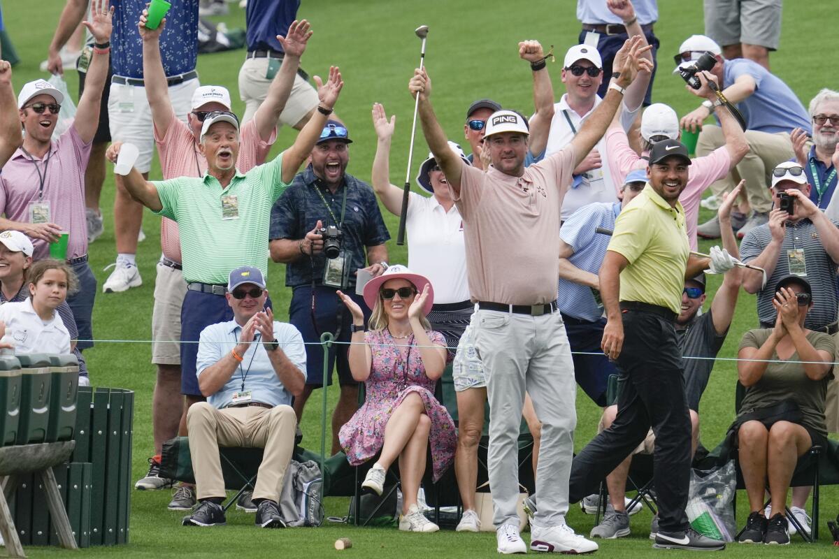 Bubba Watson celebrates after a hole-in-one on the fourth hole during the par 3 contest the Masters golf tournament.