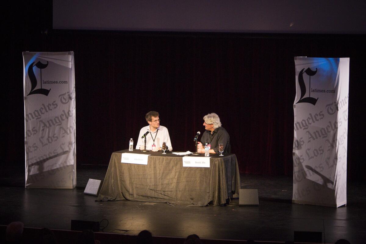 Author John Green, left, speaks with Times book critic David Ulin during the Los Angeles Times Festival of Books.