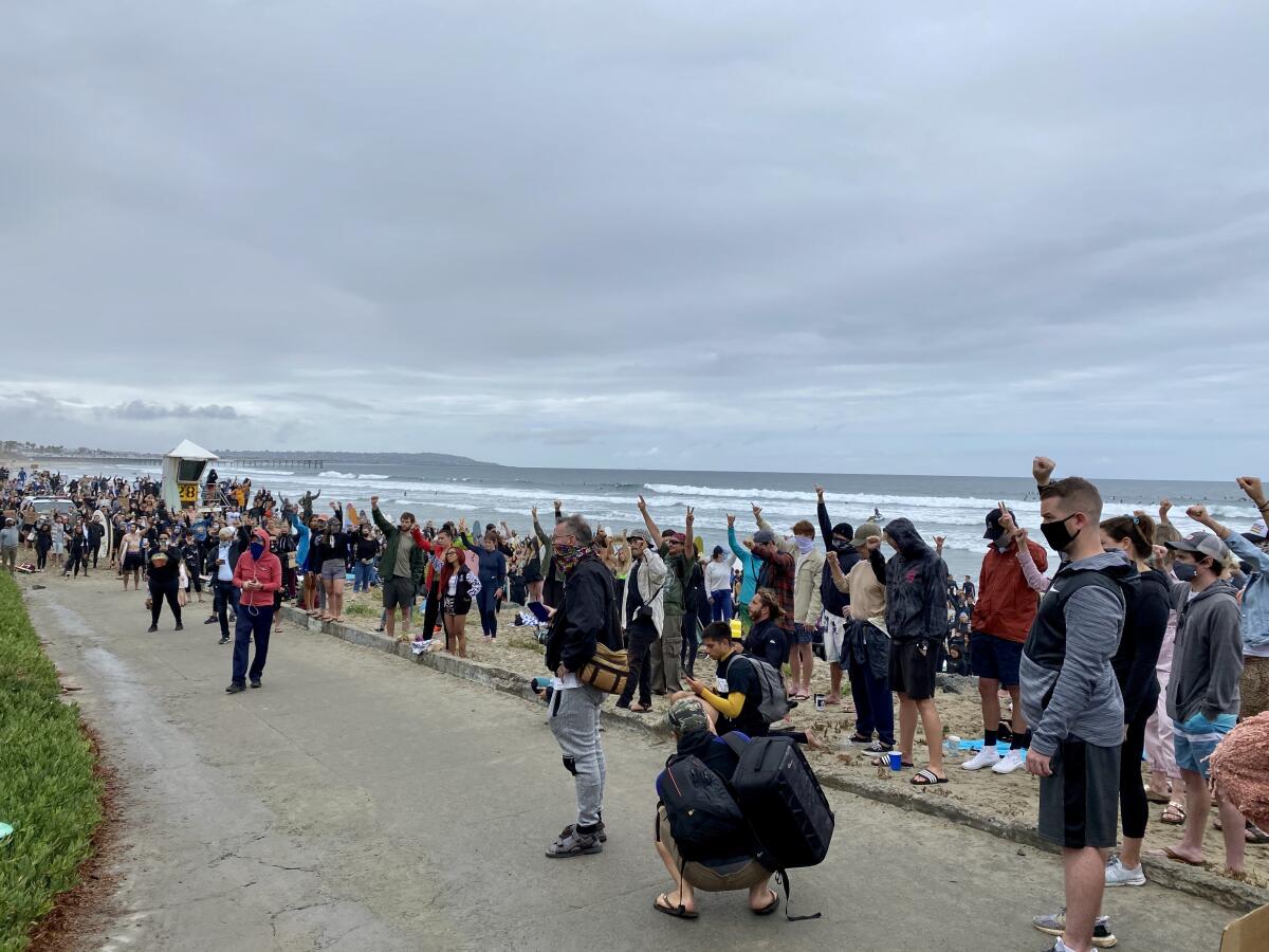 Hundreds of people attended the June 6 Paddle for Peace at Tourmaline Surfing Park to honor George Floyd.
