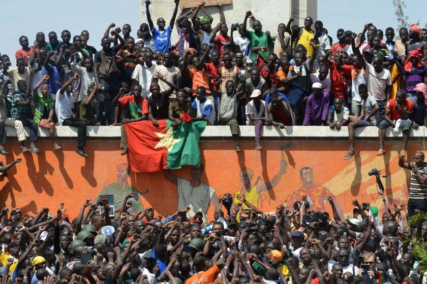 Residents of Burkina Faso's capital, Ouagadougou, celebrate after President Blaise Compaore announced that he was stepping down Oct. 31.