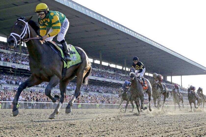 Jockey Mike Smith guides Palace Malice to victory in the Belmont Stakes on Saturday.