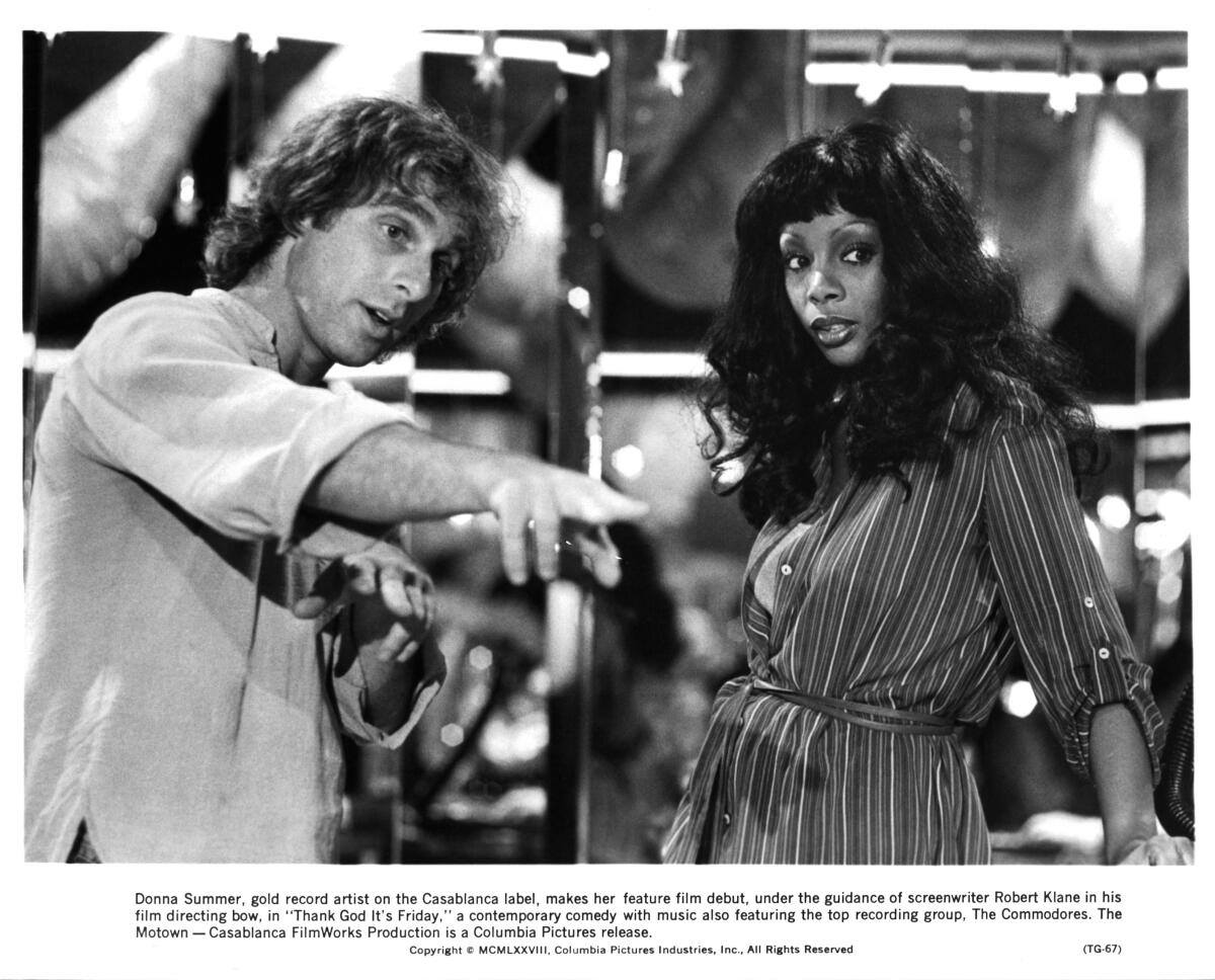 Director Robert Klane instructs actress Donna Summer 