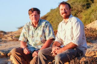 SAN DIEGO, CA November 14th, 2018 | Ed Gillet (left) and David Shively pose for photos at the Torrey Pines Glider Port on Wednesday in San Diego, California. Shively has told Gillet's story of a 1987 crossing from California to Hawaii in a kayak, in a book called Pacific Alone. | (Eduardo Contreras / San Diego Union-Tribune)