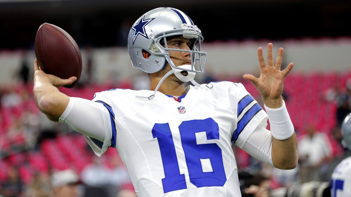 Cowboys quarterback Matt Cassel (16) warms up before a game against the Patriots on Sunday.