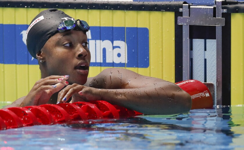 Simone Manuel reacts after winning the women's 50m freestyle final at the World Swimming Championships.