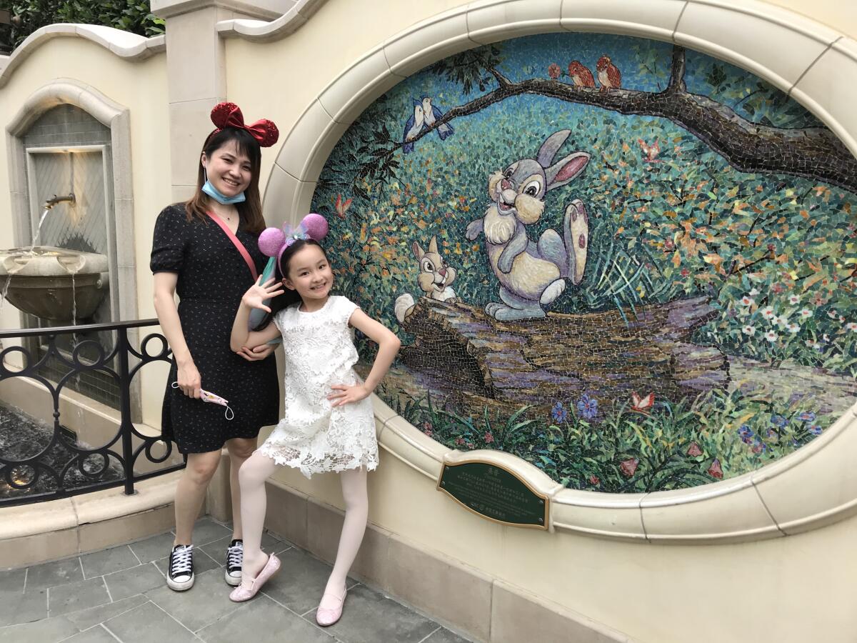 Liu Jiali, 39, and her daughter Margaret Liu, 8, were on a Shanghai Disneyland trip before Margaret's long-awaited return to second grade.