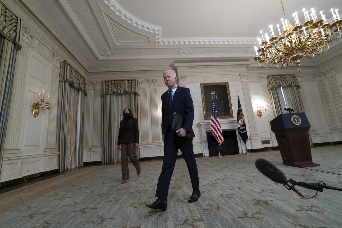 President Biden walks from the lectern.