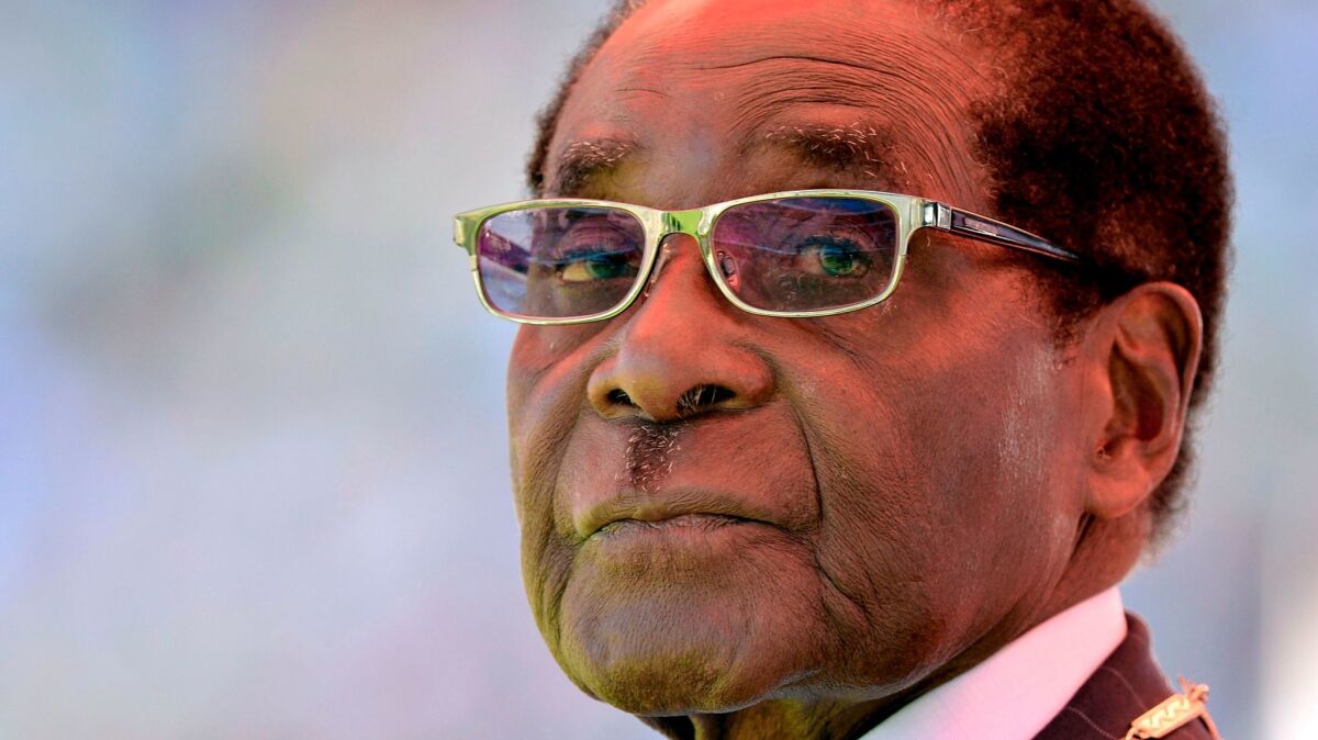 In 2013, Zimbabwean President Robert Mugabe looks on during his inauguration and swearing-in ceremony at the 60,000-seat sports stadium in Harare.